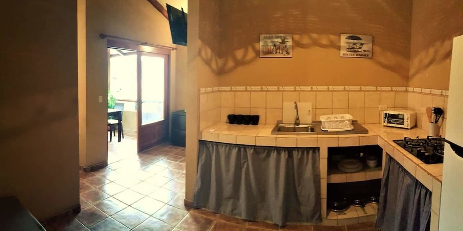 Apartamento standard, 1 cama King | Cozinha privada | Geladeira grande, cooktop, cafeteira/chaleira
