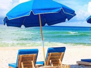 On the beach, sun-loungers