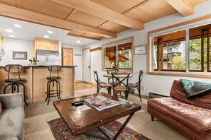 A modern kitchen with wooden cabinets and a built-in refrigerator. - RMR: La Choumine 6 Condo in Teton Village / Steps from the Mountain! (Teton Village)