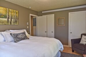 1 bedroom, desk, iron/ironing board, travel crib
