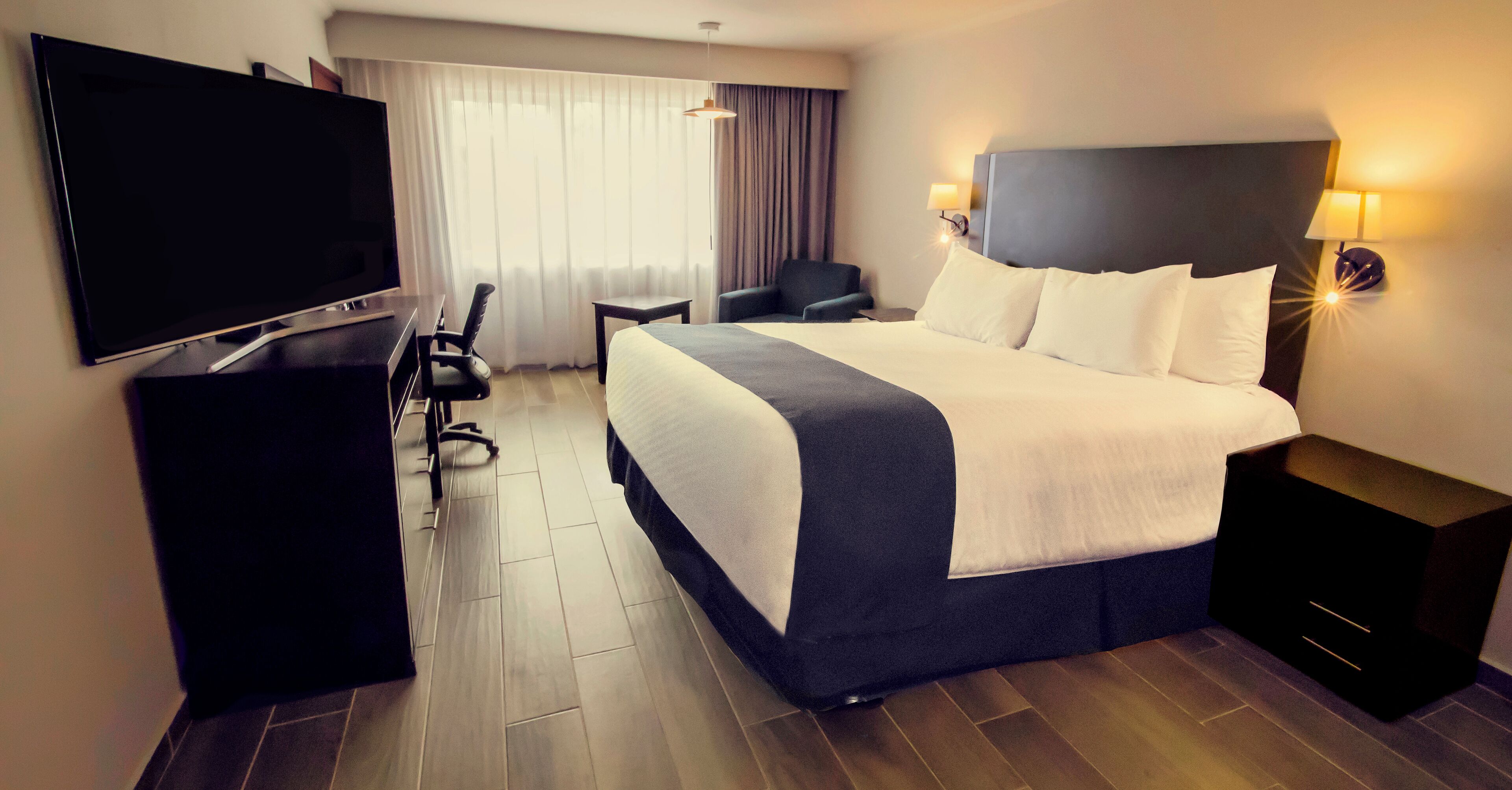 superior room, 1 king bed, non smoking | in-room safe, desk, iron/ironing board, free rollaway beds