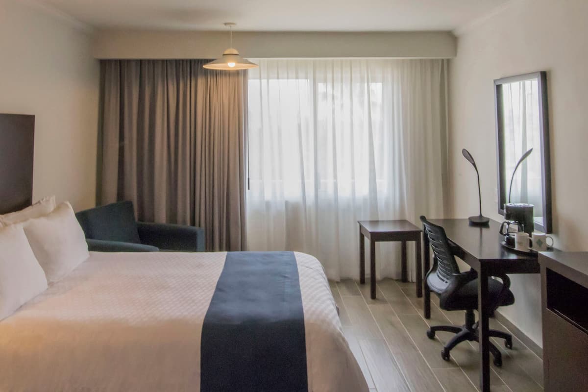 superior room, 1 king bed, non smoking | in-room safe, desk, iron/ironing board, free rollaway beds