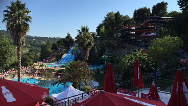A water park with multiple slides and a swimming pool. - Luxury design villa with private heated pool, near the city of Porto! (Sanguedo)
