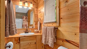 Combined shower/tub, hair dryer, towels, soap