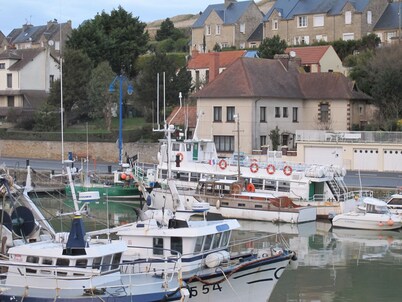 Comfortable house overlooking the port and close to shops.