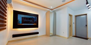 Room (303) | Living area | 50-inch LCD TV with digital channels, TV, pay films