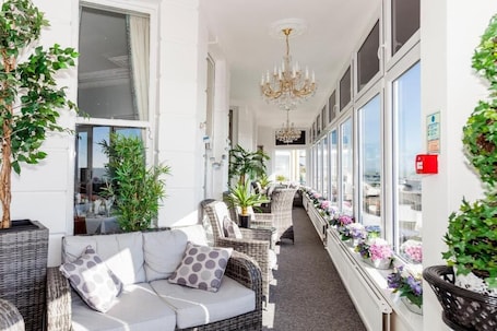 Terrace/patio. East Beach Hotel