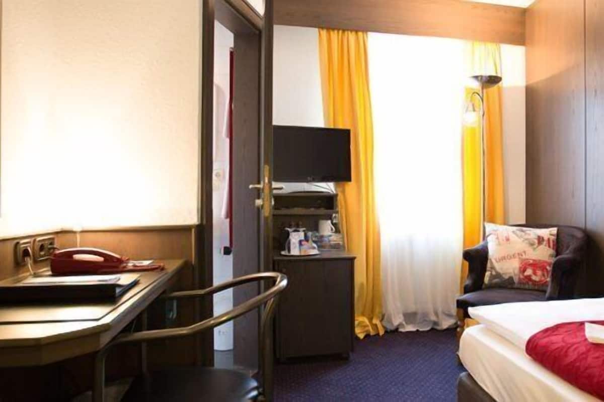 Luxe beddengoed, een kluis op de kamer, een bureau, gratis wifi