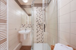 Shower, free toiletries, hair dryer, slippers