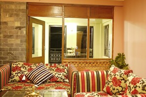 Apartment | Living area | Flat-screen TV - Soaltee Homestay (Kathmandu)