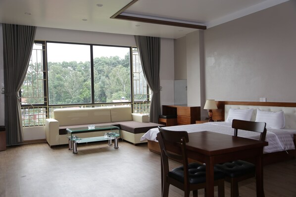 Business Studio Suite, 1 King Bed, Kitchen, Hill View | Living area | Flat-screen TV - Vũ Gia Khánh Apartment (Hai Phong)
