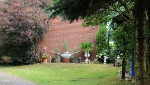 A paved pathway leading to a brick wall with a sign that reads "Casa de la Cultura." - Apartment in Starsow (21456) (Mirow)