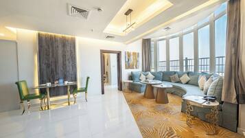 Royal Suite, 2 Bedrooms | Living area | 43-inch flat-screen TV with cable channels, TV