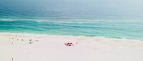 On the beach, sun-loungers