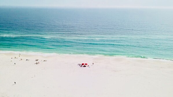 On the beach, sun-loungers