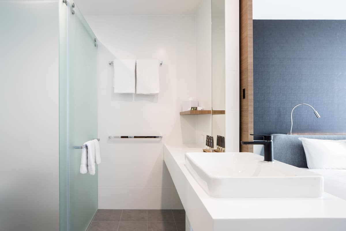 shower, eco-friendly toiletries, hair dryer, towels