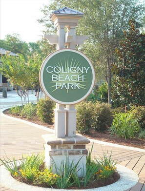 Discover the charm of Coligny Beach Park, where beautiful landscaping surrounds a historic sign.