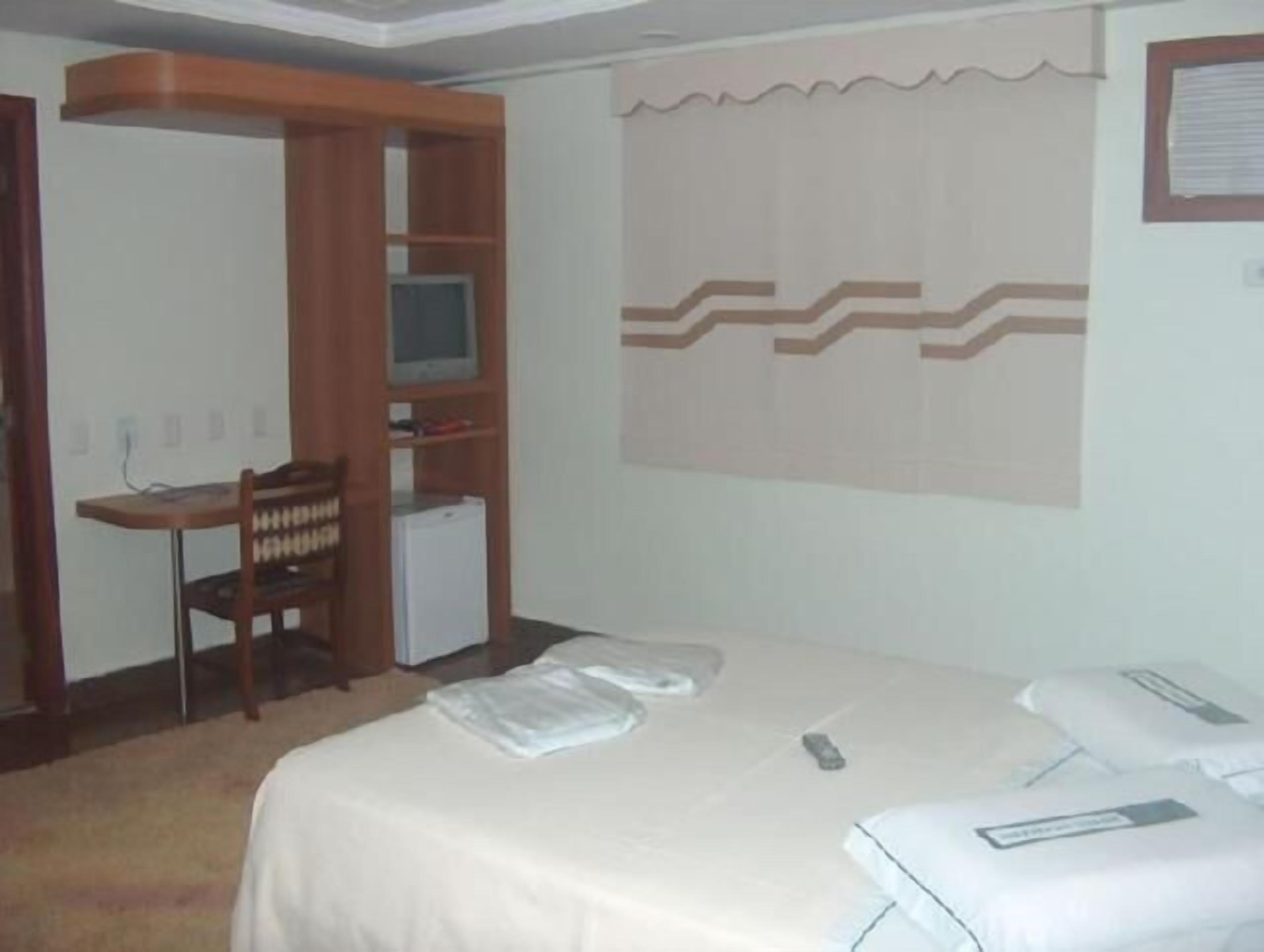 minibar, desk, blackout curtains, iron/ironing board