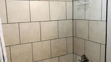 Combined shower/tub, hair dryer, towels, soap
