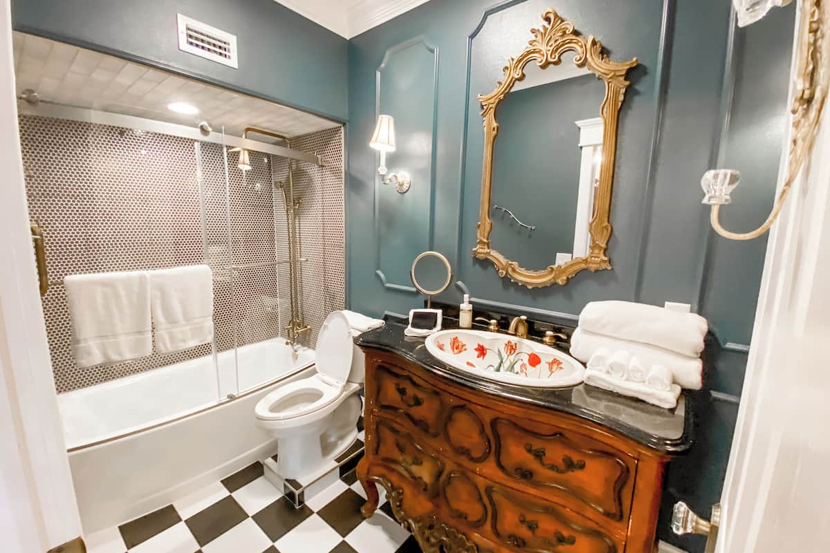 the rose tearoom suite | bathroom | shower, hair dryer, towels, soap