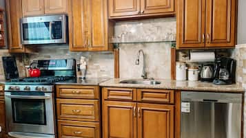 Microwave, coffee/tea maker, cookware/dishes/utensils, paper towels