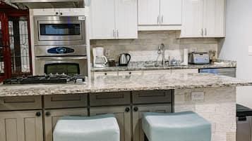 Microwave, coffee/tea maker, cookware/dishes/utensils, paper towels