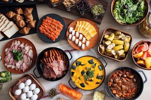 A variety of food items including meats, vegetables, and fruits arranged on a table. - Hotel Vista Premio Kyoto Nagomitei (Kyoto)