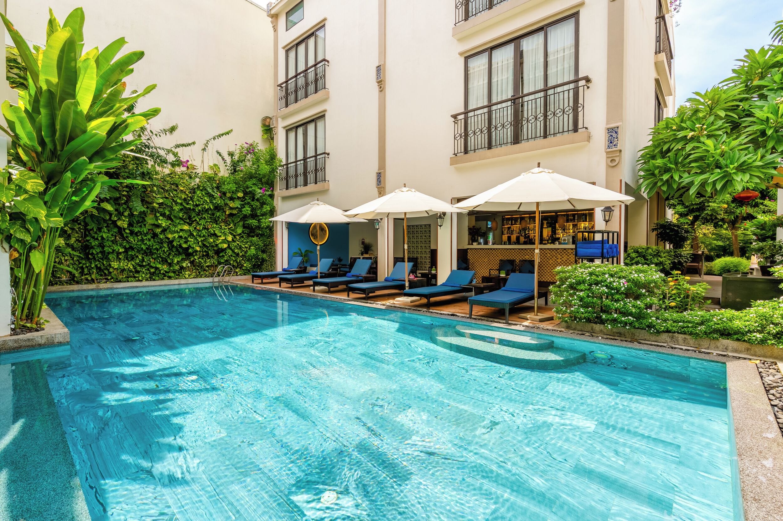 outdoor pool, pool umbrellas, pool loungers