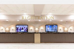 A registration desk with a marble floor and a ceiling with recessed lighting. - Westgate Lakes Resorts and Spa (Orlando)