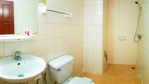 A bathroom with a sink, toilet, and shower. - Eastiny Bella Vista Hotel (Pattaya)