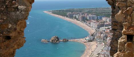 On the beach, sun-loungers, beach towels