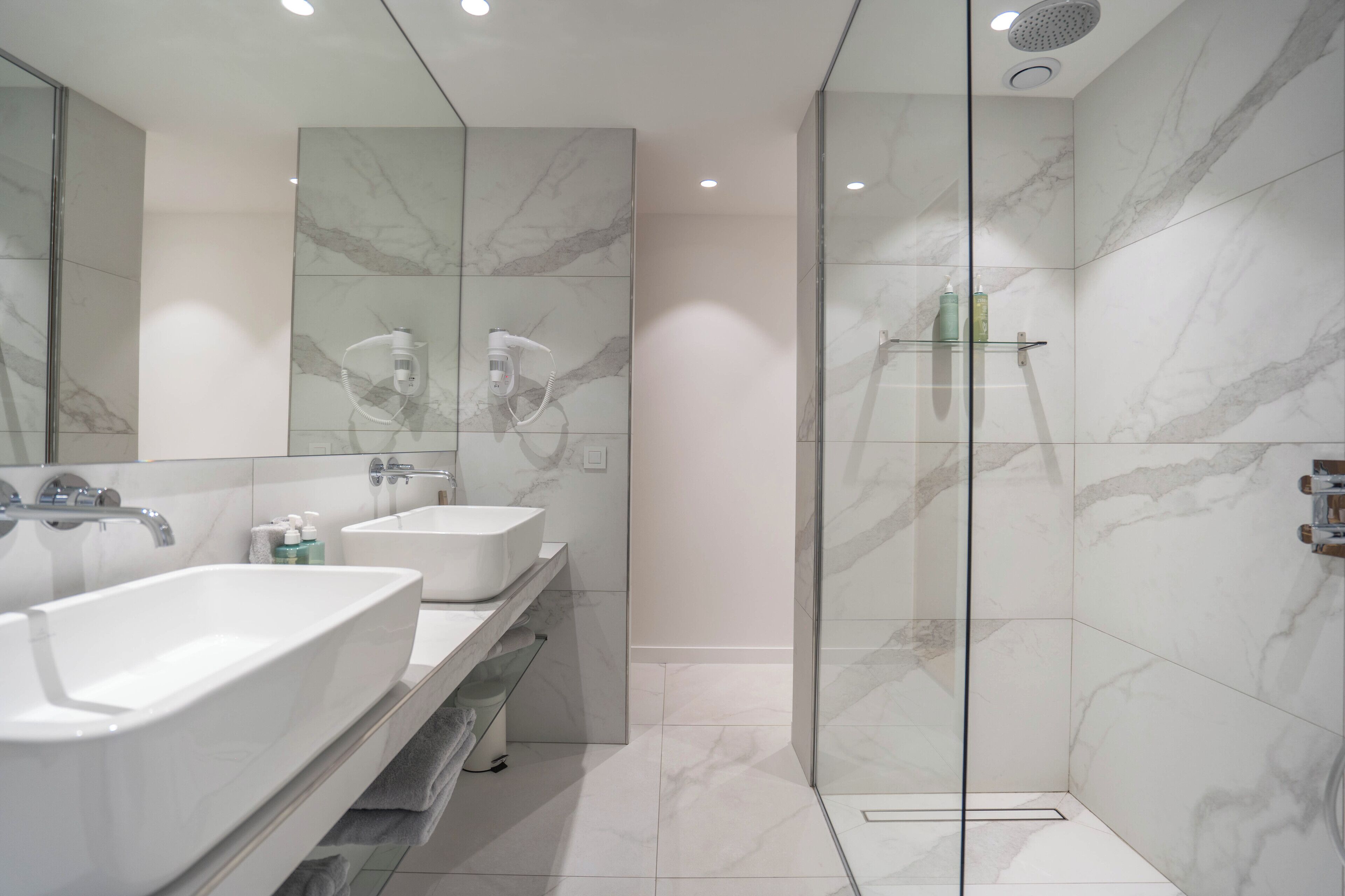 apartment | bathroom | hair dryer, slippers, towels