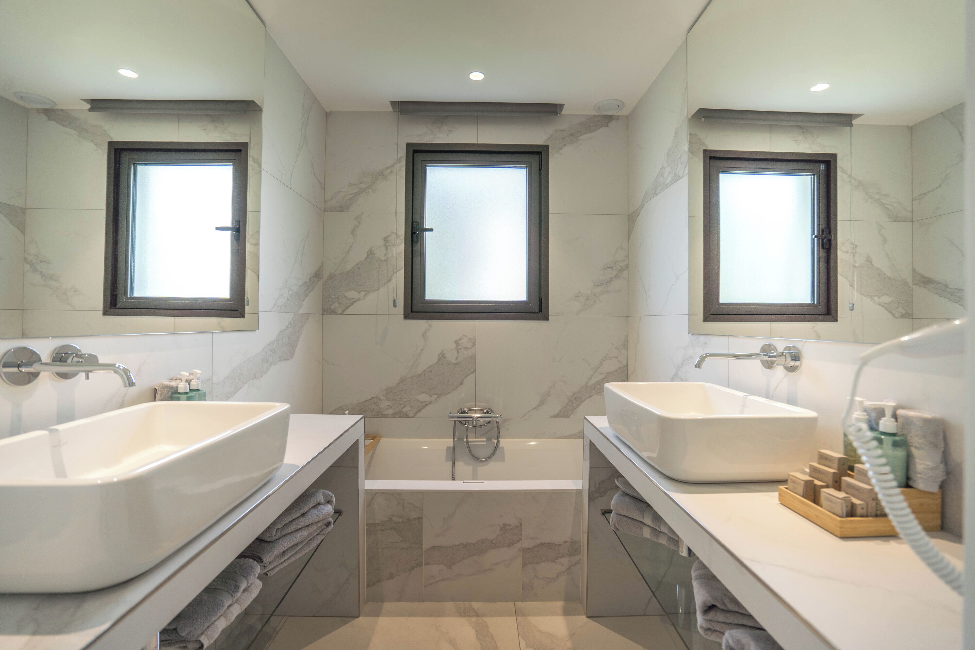 apartment | bathroom | hair dryer, slippers, towels