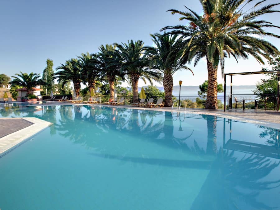 2 outdoor pools, a waterfall pool, open 8 AM to 8 PM, pool umbrellas