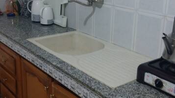 Fridge, stovetop, coffee/tea maker, cookware/dishes/utensils