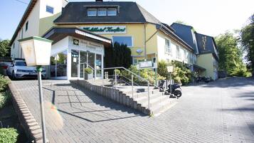 Hotel Kauffmann features a traditional two-story building with a pitched roof and balcony.