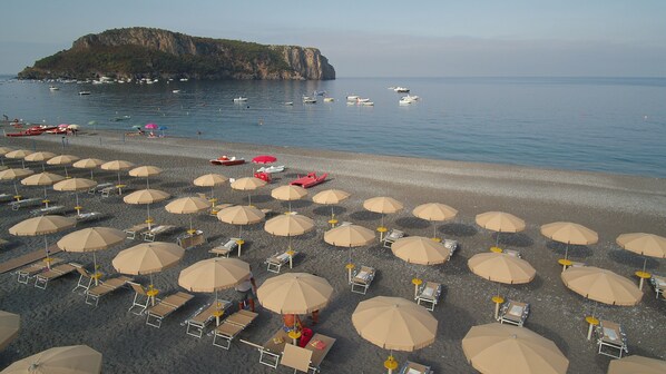 Private beach, white sand, sun-loungers, beach umbrellas