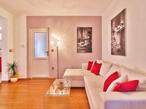 Apartment, 1 King Bed with Sofa bed | Living room | Flat-screen TV