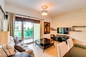 Comfort Apartment, 1 Queen Bed, Garden Area | Living area | 50-inch flat-screen TV with cable channels, TV - 1 Bedroom Apartment Greens (Dubai)