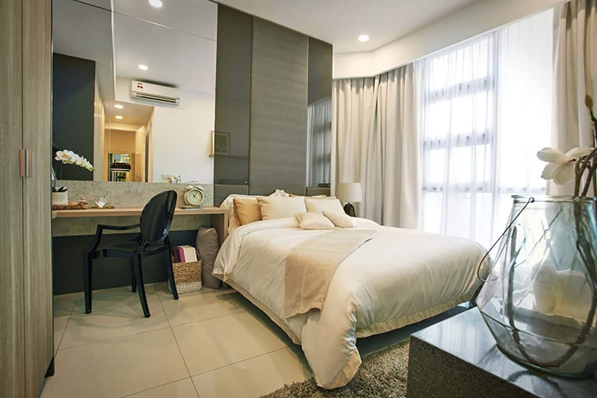 A modern hotel room with a bed, a desk, a chair, and a large window with curtains.