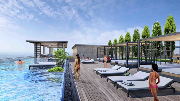 A rooftop infinity pool with lounge chairs and a covered seating area. - Louis Kienne Hotel Pemuda (Semarang)