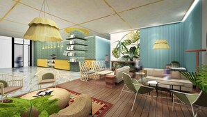 A spacious lounge area with a high ceiling, modern furniture, and a variety of seating options. - Louis Kienne Hotel Pemuda (Semarang)