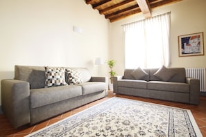 Apartamento, 2 quartos | Área de estar