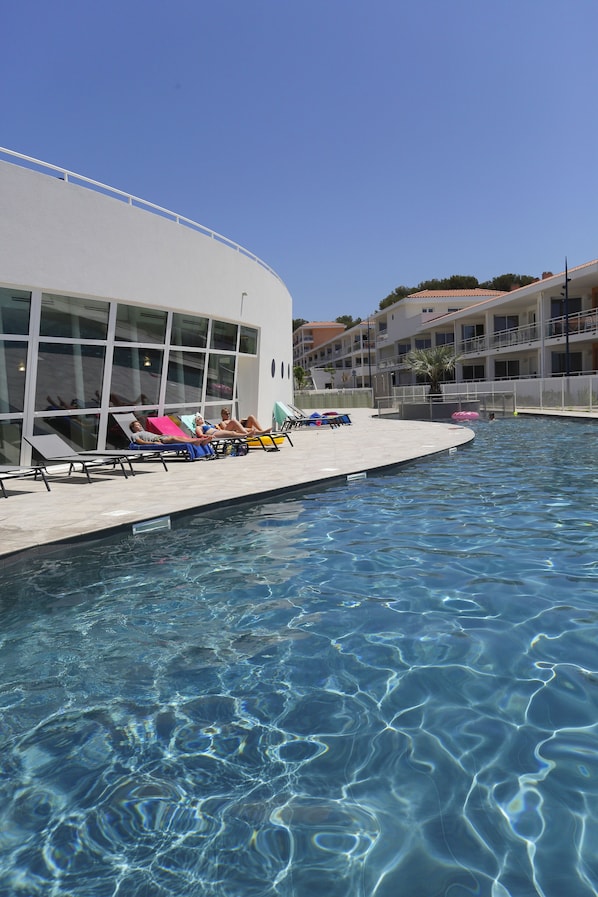 Indoor pool, seasonal outdoor pool, pool umbrellas, pool loungers