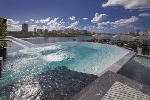 Outdoor pool, open 8:00 AM to 8:00 PM, cabanas (surcharge)