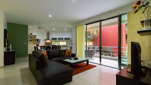 Deluxe Apartment, 3 Bedrooms, Poolside | Living room | 50-inch flat-screen TV with cable channels, TV, Netflix - Capri By CocoBR (Playa del Carmen)