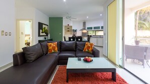 Deluxe Apartment, 3 Bedrooms, Poolside | Living room | 50-inch flat-screen TV with cable channels, TV, Netflix - Capri By CocoBR (Playa del Carmen)
