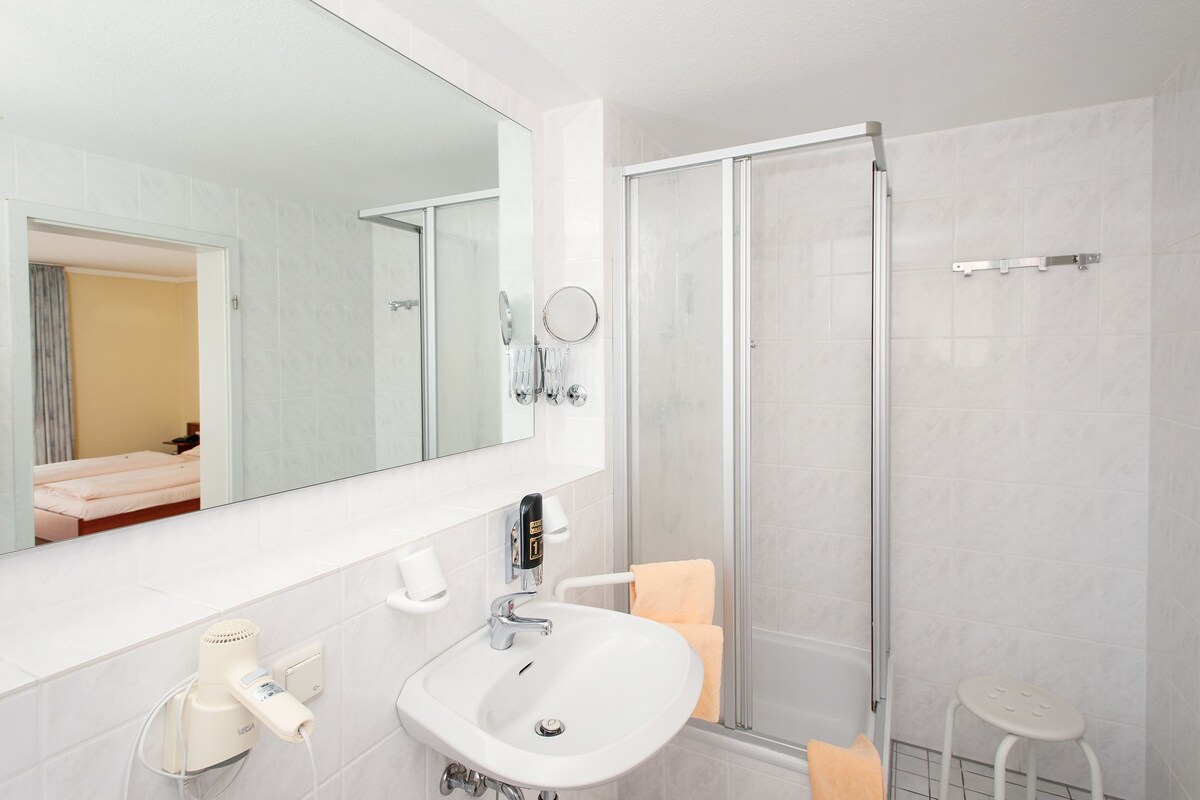 Bathroom | Shower, hair dryer, bathrobes, towels