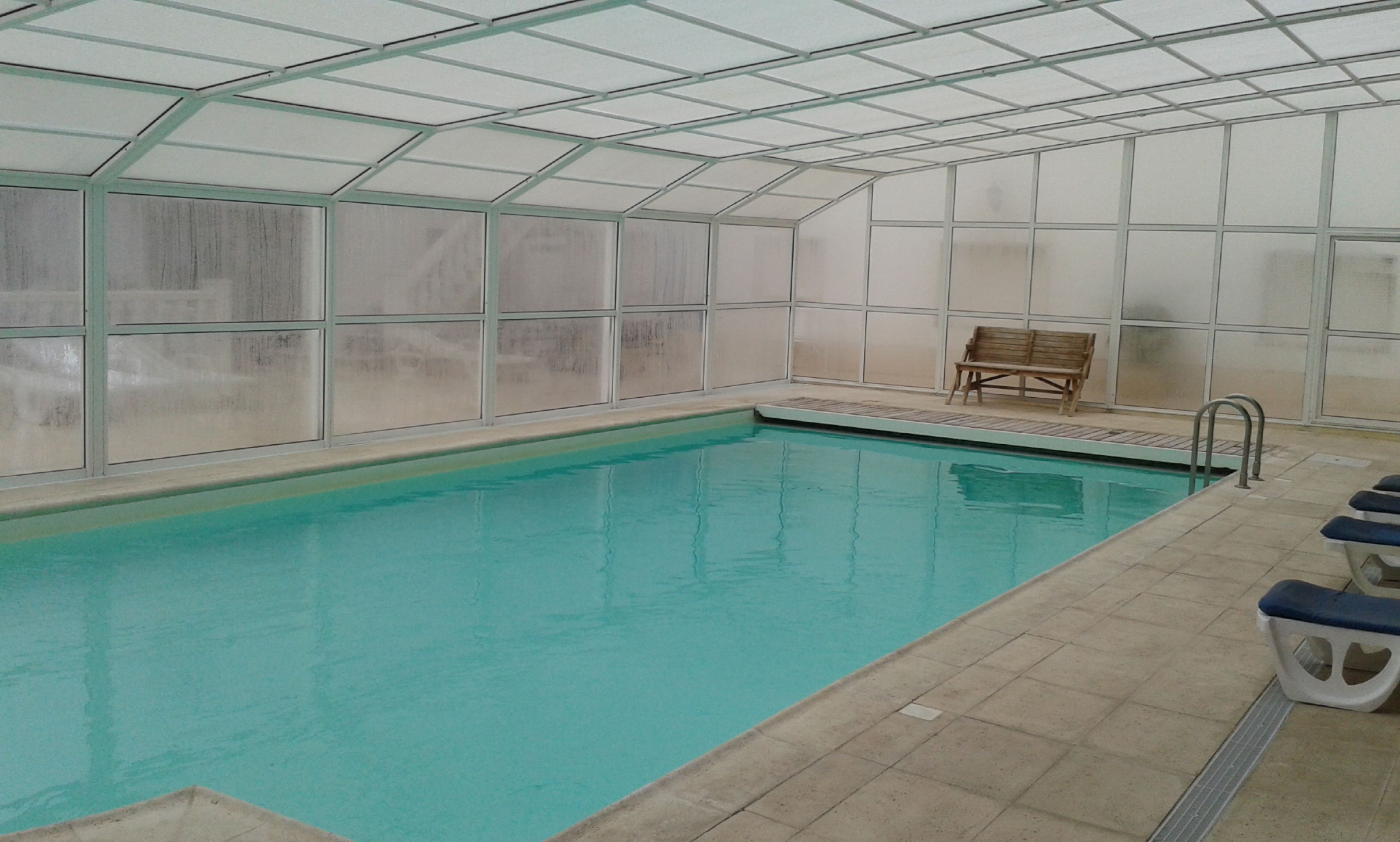 Indoor pool, outdoor pool, open 9 AM to 8 PM, pool umbrellas