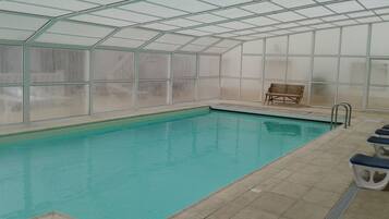 Indoor pool, outdoor pool, open 9 AM to 8 PM, pool umbrellas